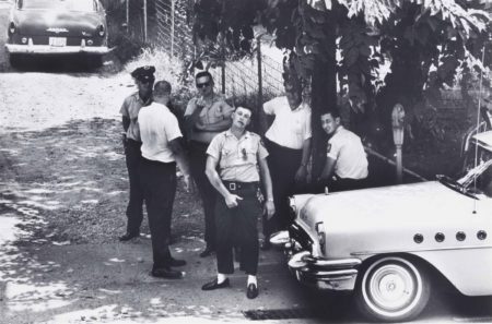 Police pose for a photograph as ministers from the National Council of Churches march to a local church, Clarksdale, Mississippi-1963 Police pose for a photograph as ministers from the National Council of Churches march to a local church, Clarksdale, Mississippi-1963