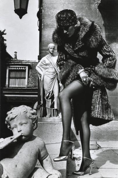 Woman in Fur coat adjustint stocking, Paris, Vogue-1975 Woman in Fur coat adjustint stocking, Paris, Vogue-1975