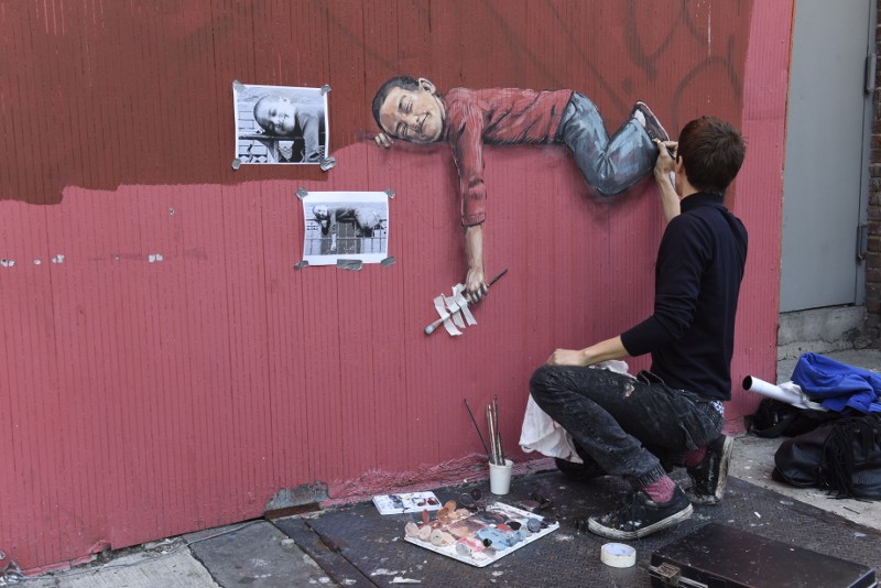 Ernest Zacharevic - Boy On Fence making of - Photo Credit Martha Cooper