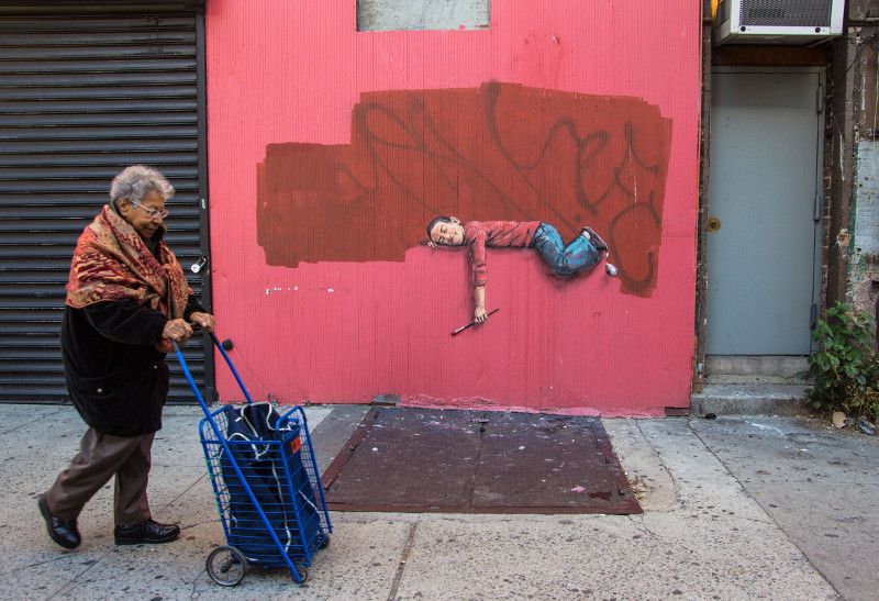 Ernest Zacharevic - Boy on a fence street view - Photo Credit Ernest Zacharevic