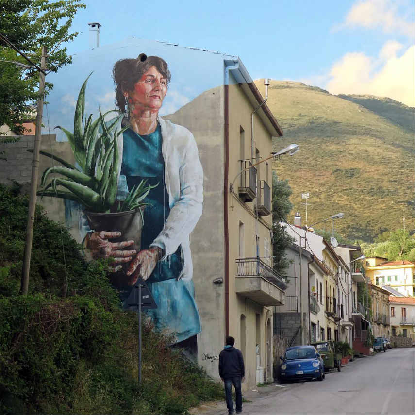Fintan Magee - Woman with aloe Vera plant, Sapri, Italy, 2016