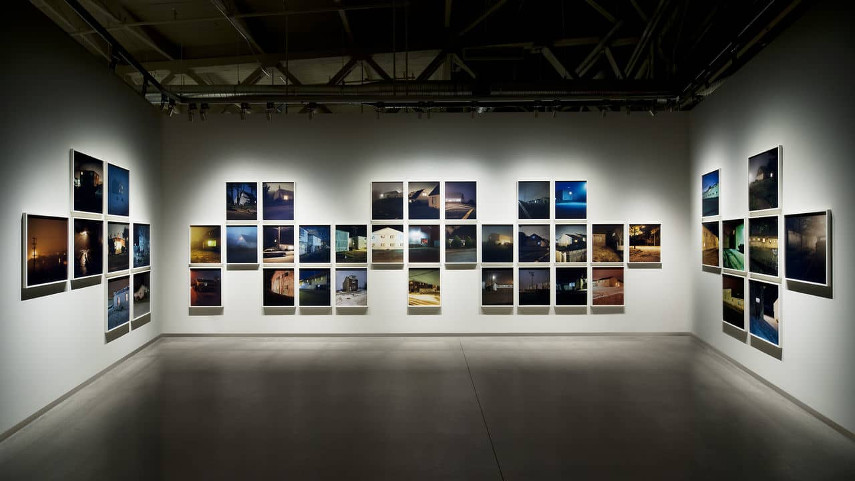 New Road House gallery locations use a book and a home page to attract viewers