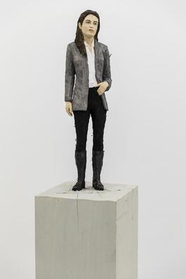 Woman in grey blazer and boots