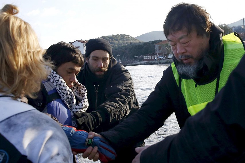 Ai Weiwei helping the newly-arrived refugees