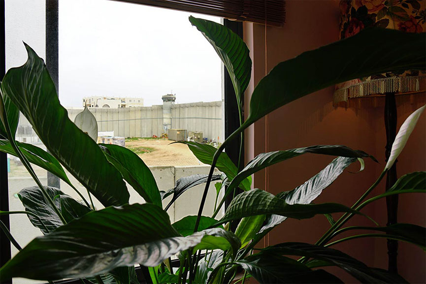 the hotel features rooms overlooking the israeli wall around the palestinian city of bethlehem