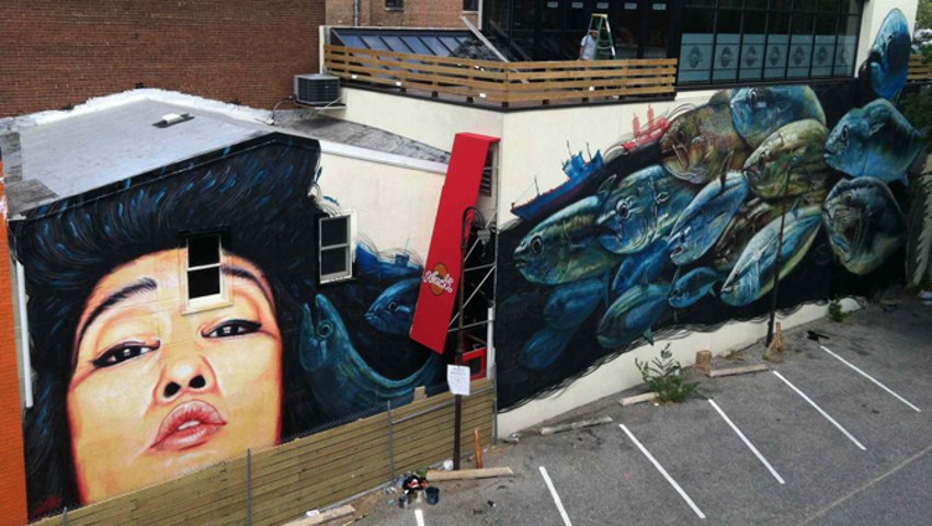 gaia's  street art mural next to a gallery in Washington DC, 