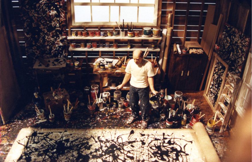 Photo portrait of the legendary Jackson Pollock working in his studio