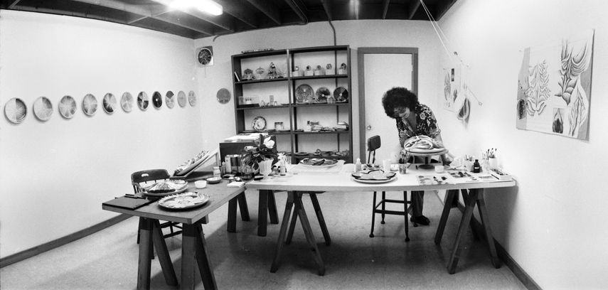 Judy Chicago in the China Painting Studio while working at the Dinner Party, 1975