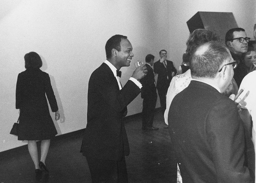 Kynaston McShine (center) at the opening of Primary Structures