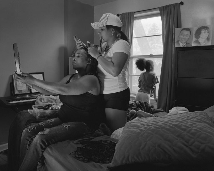 Shea doing crochet braids in her cousin Andrea’s hair for Andrea’s daughter’s wedding, 2016 / 2017
