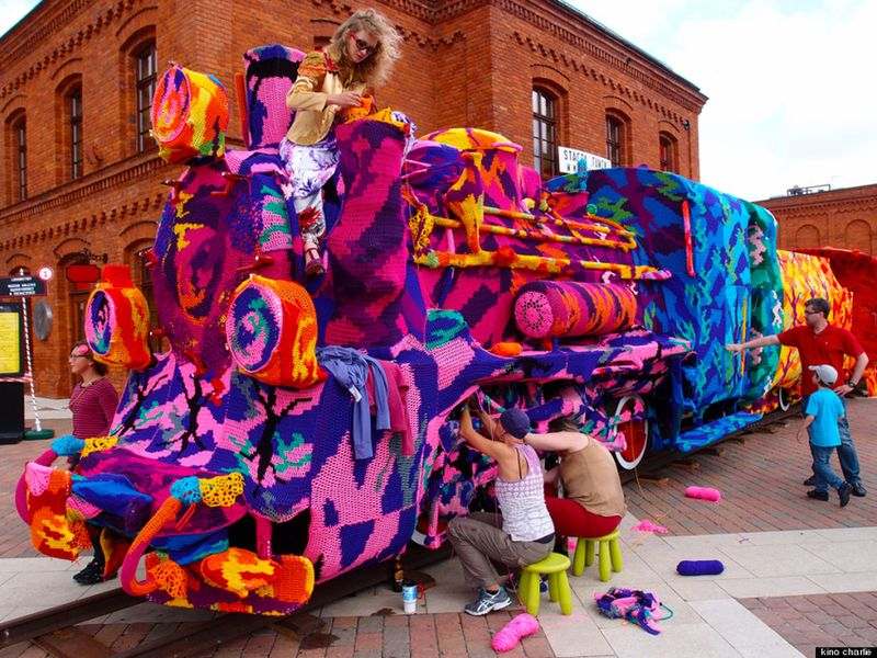 Colorful crochet knit on a tree trunk yarn bombing. Patchwork