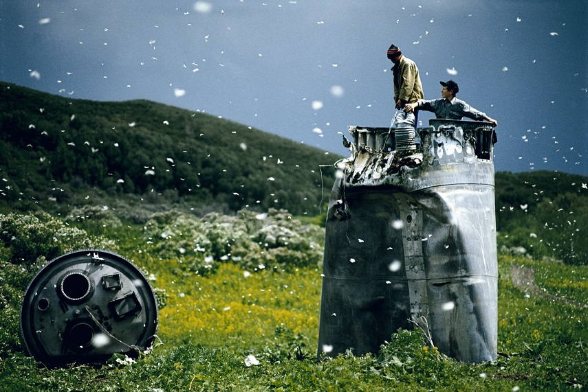 Villagers collecting scrap from a crashed spacecraft, Altai Territory, Russia, 2000 © Jonas Bendiksen Magnum Photos